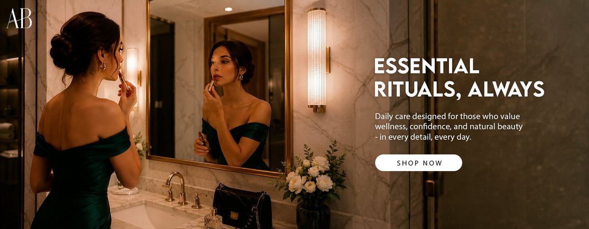 Woman in an emerald dress reflected in a brass-framed mirror while applying lipstickh3