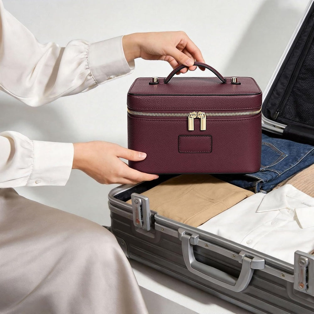 Vanity case placed inside a suitcase while packing for a trip